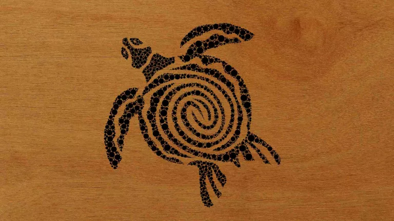 Woodburn art of a big turtle swimming