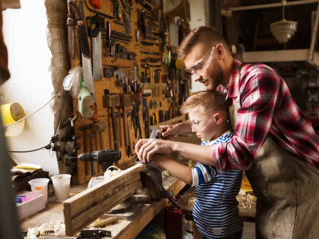 Alex, 7 years old, always wears goggles while he is having a hands on experience of woodworking