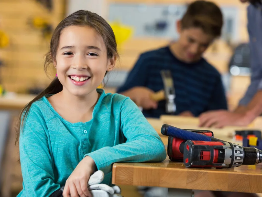 Kids socialize while doing woodworking