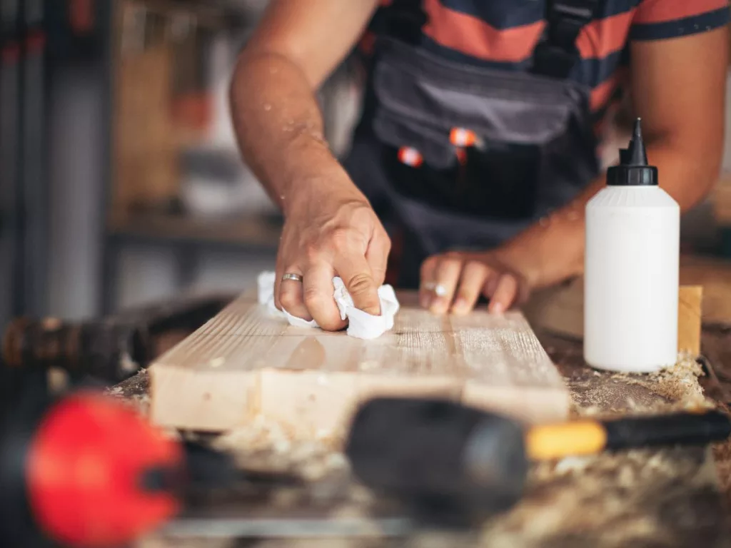 Using sawdust and glue to repair wood surfaces