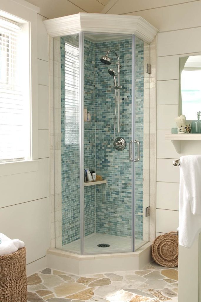 A Beautiful Frameless Glass Shower with Ocean Tiles